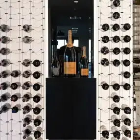 Cable and Glass wine racks in a modern wine cellar